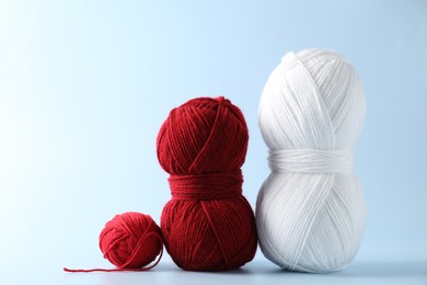 Photo of Different colorful yarns on light background. Knitting material