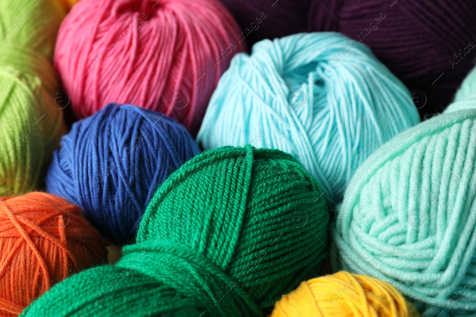 Photo of Many different yarns as background, closeup view