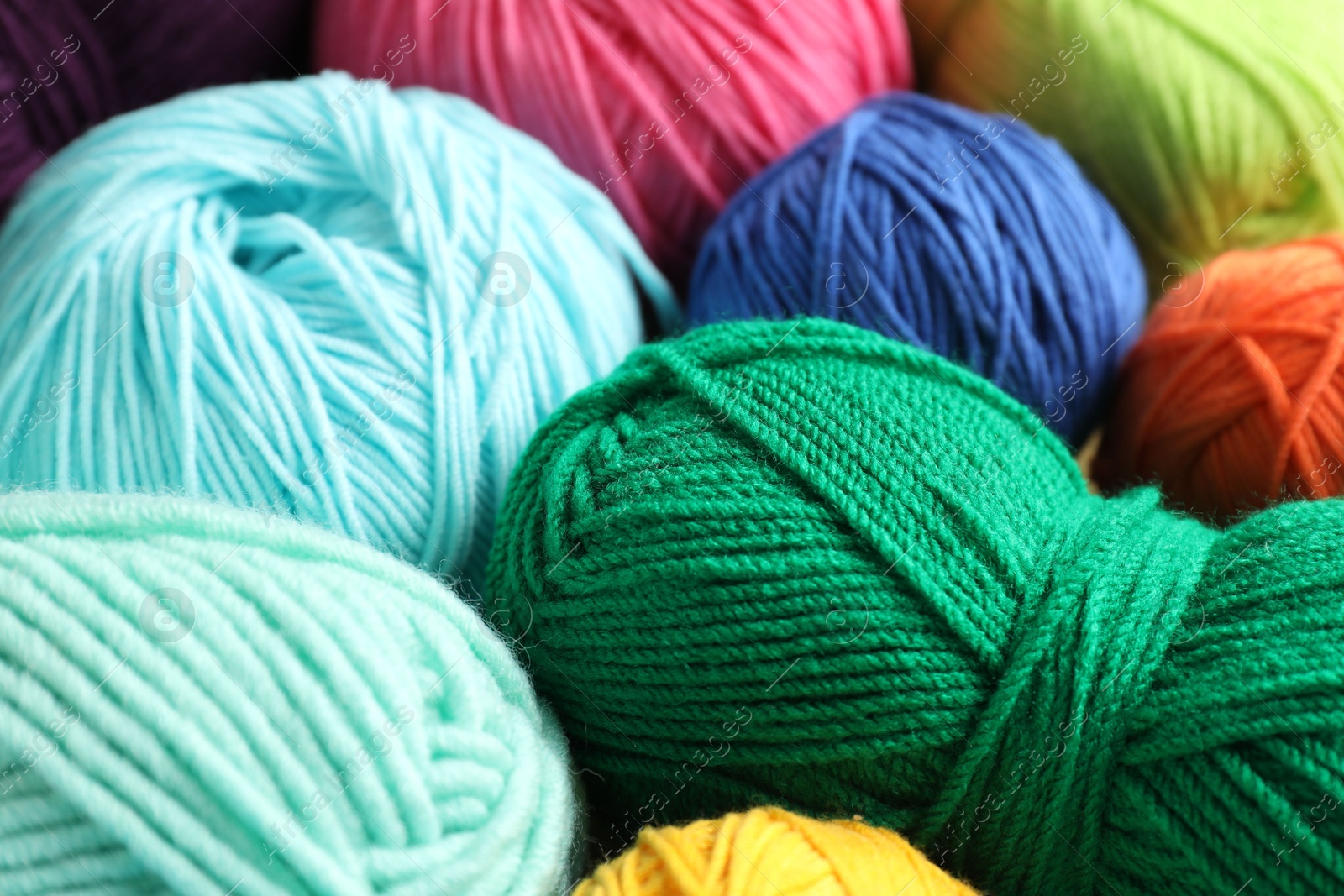 Photo of Many different yarns as background, closeup view