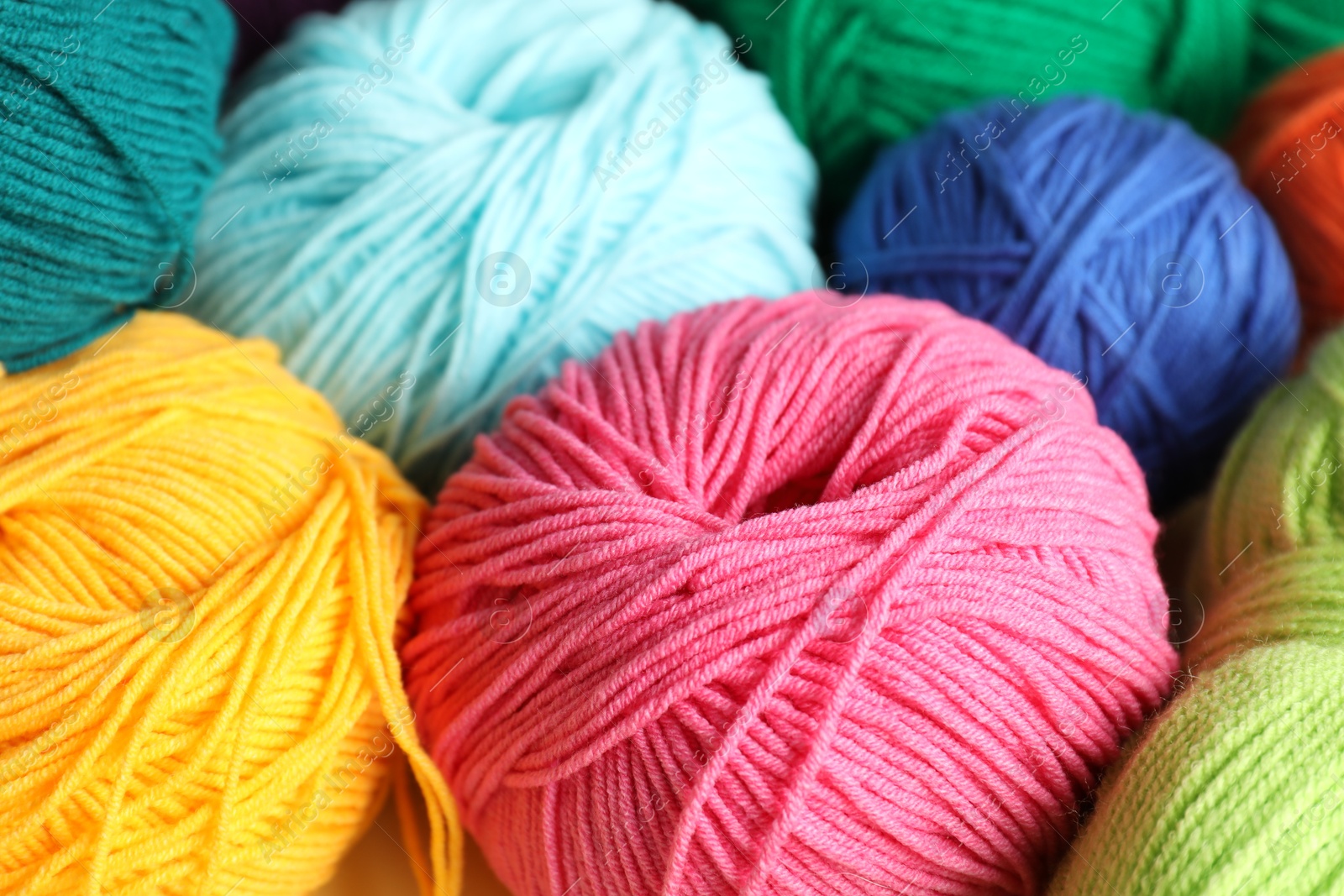 Photo of Many different yarns as background, closeup view