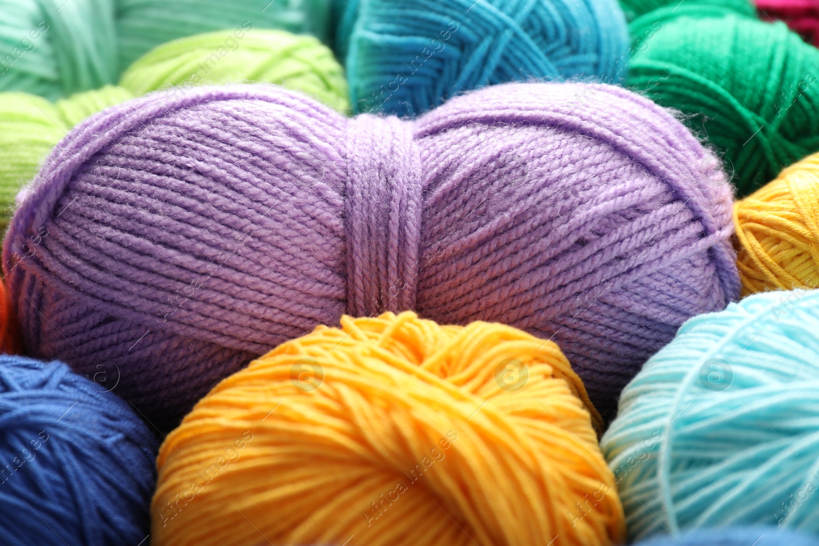 Photo of Many different yarns as background, closeup view