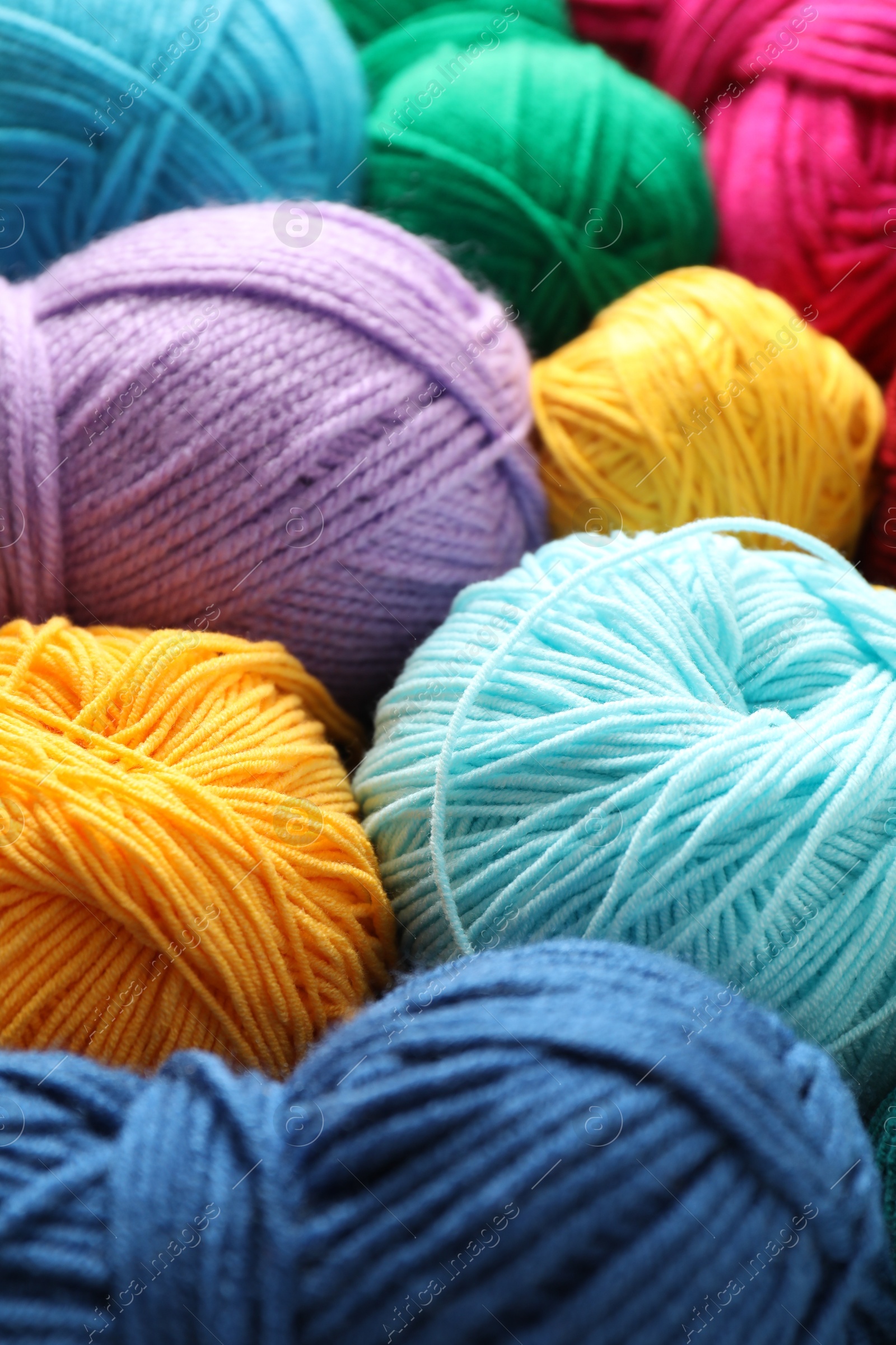 Photo of Many different yarns as background, closeup view