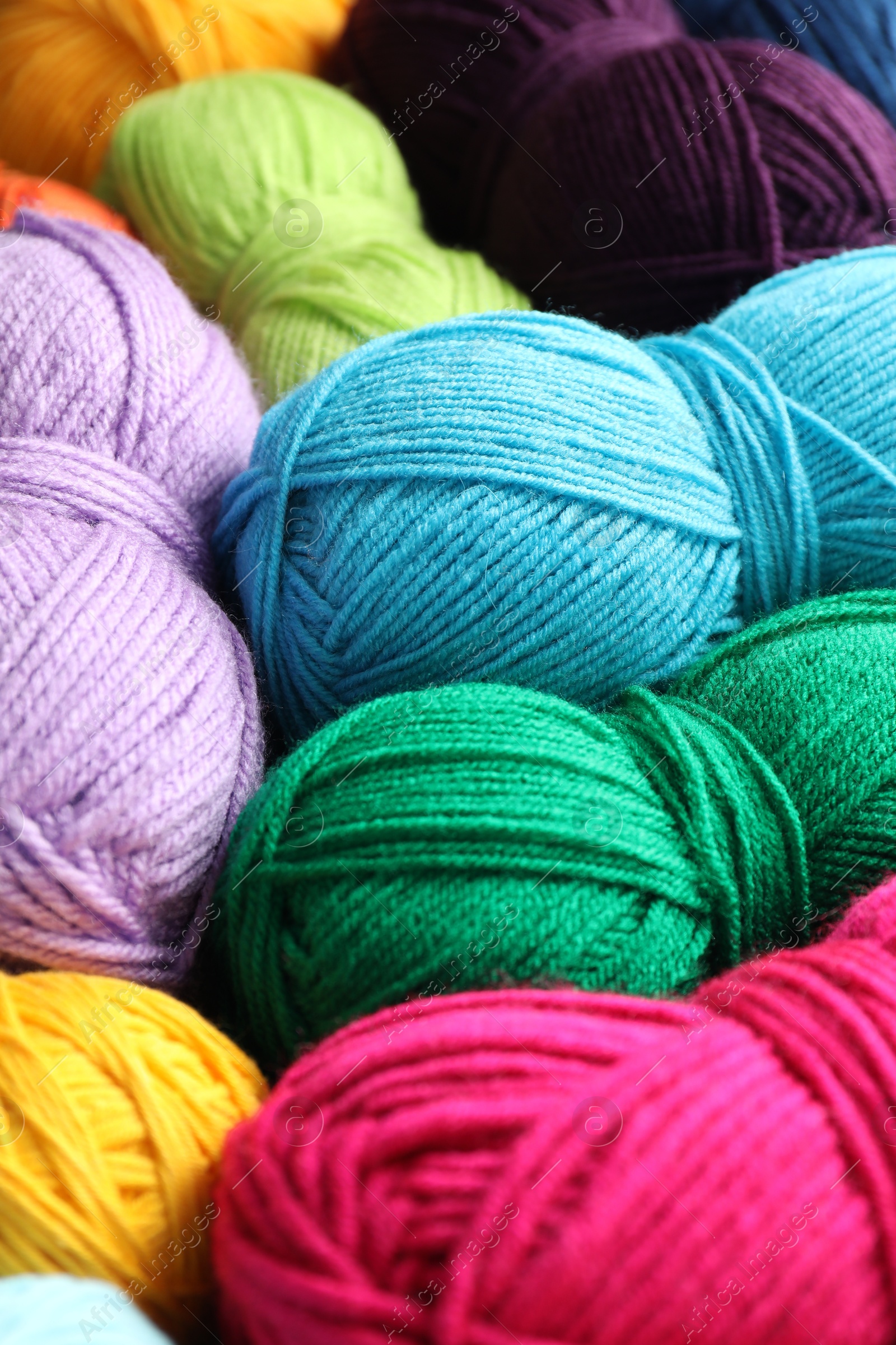 Photo of Many different yarns as background, closeup view