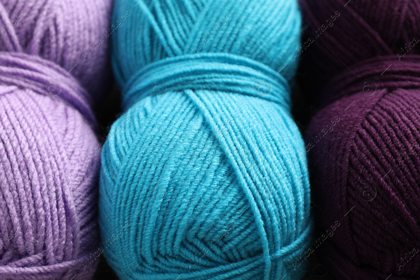 Photo of Many different yarns as background, closeup view