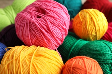 Photo of Many different yarns as background, closeup view