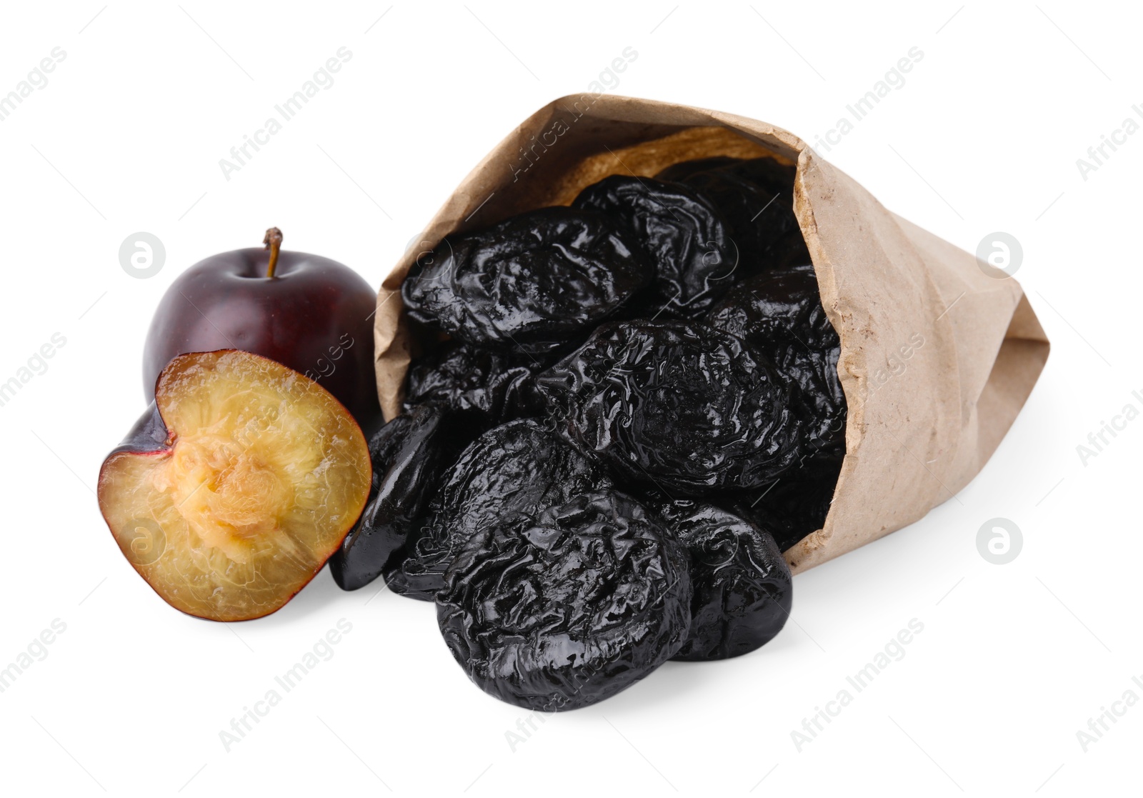 Photo of Paper bag with delicious prunes and fresh ripe plums isolated on white