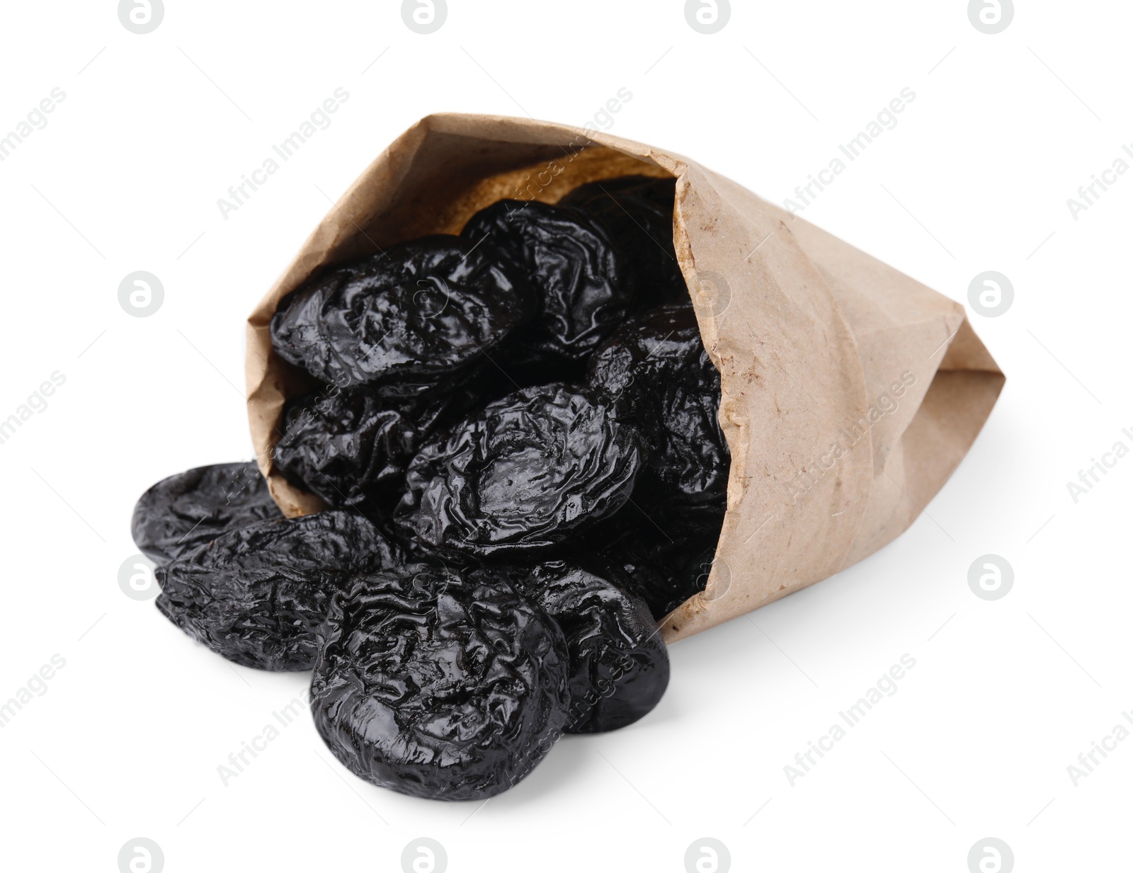 Photo of Paper bag with tasty dried plums (prunes) isolated on white