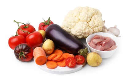 Photo of Different vegetables and raw meat for stew isolated on white