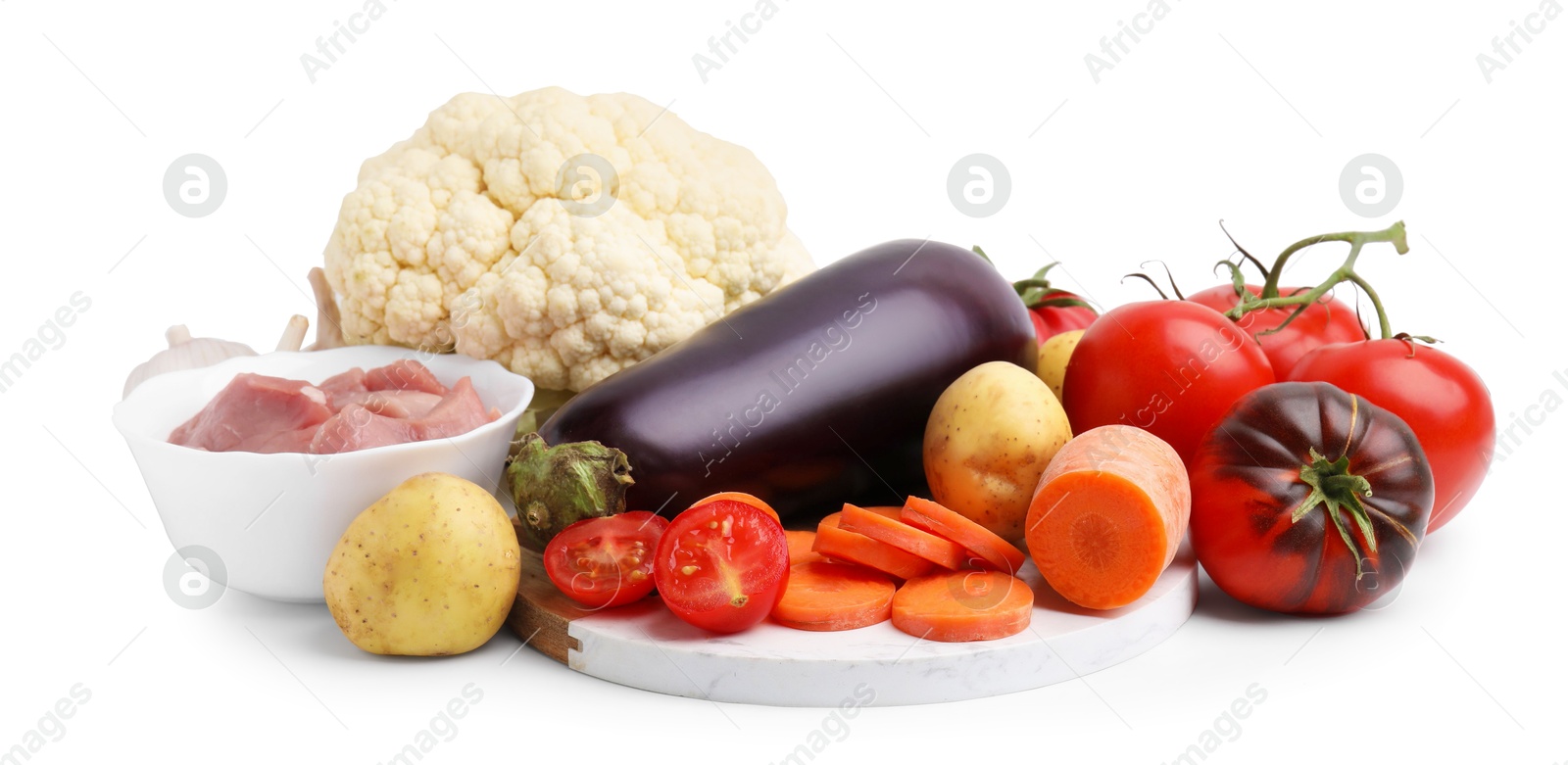 Photo of Different vegetables and raw meat for stew isolated on white