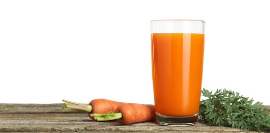 Fresh carrot juice in glass and vegetables on wooden table against white background. Space for text