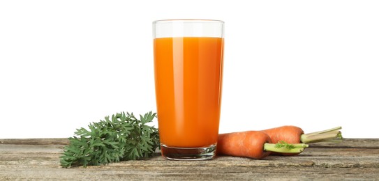 Photo of Fresh carrot juice in glass and vegetables on wooden table against white background