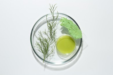 Photo of Petri dishes with green twig and cosmetic products on white background, top view