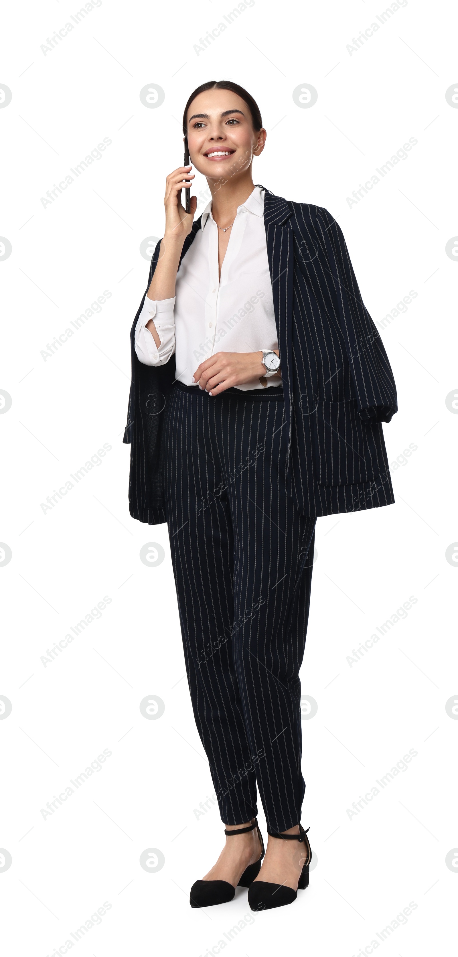 Photo of Beautiful woman in black striped suit talking on phone against white background