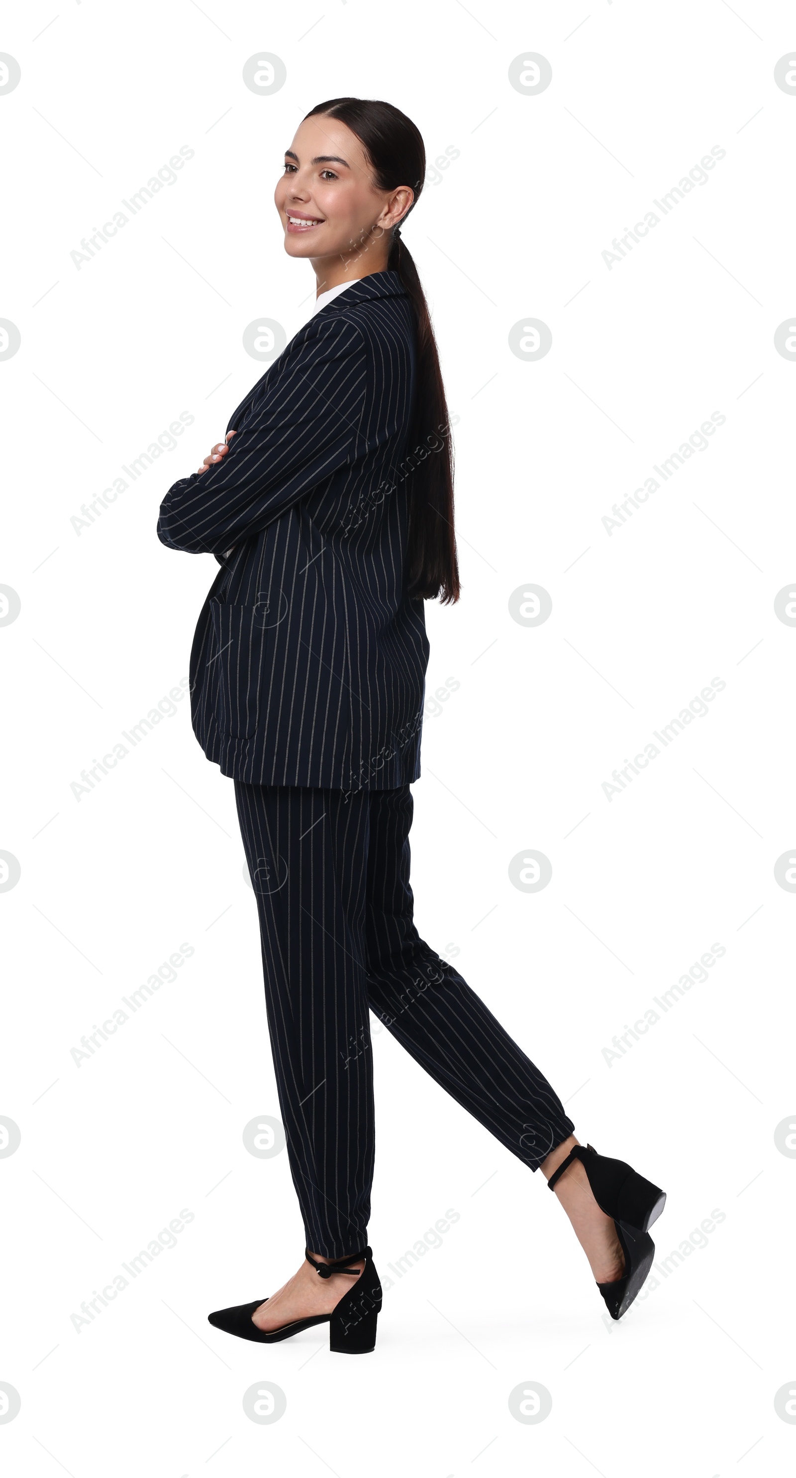 Photo of Beautiful woman in black striped suit on white background