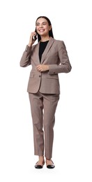 Beautiful woman in beige suit talking on phone against white background