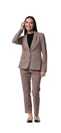 Beautiful woman in beige suit on white background