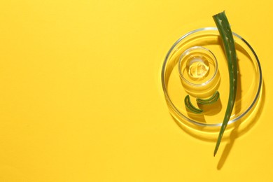 Photo of Petri dishes with green aloe vera leaves and gel on yellow background, top view. Space for text