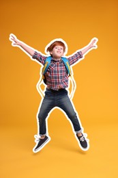 Image of Happy school child with backpack jumping on orange background