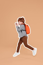 Image of Cute school child with backpack running on dark beige background
