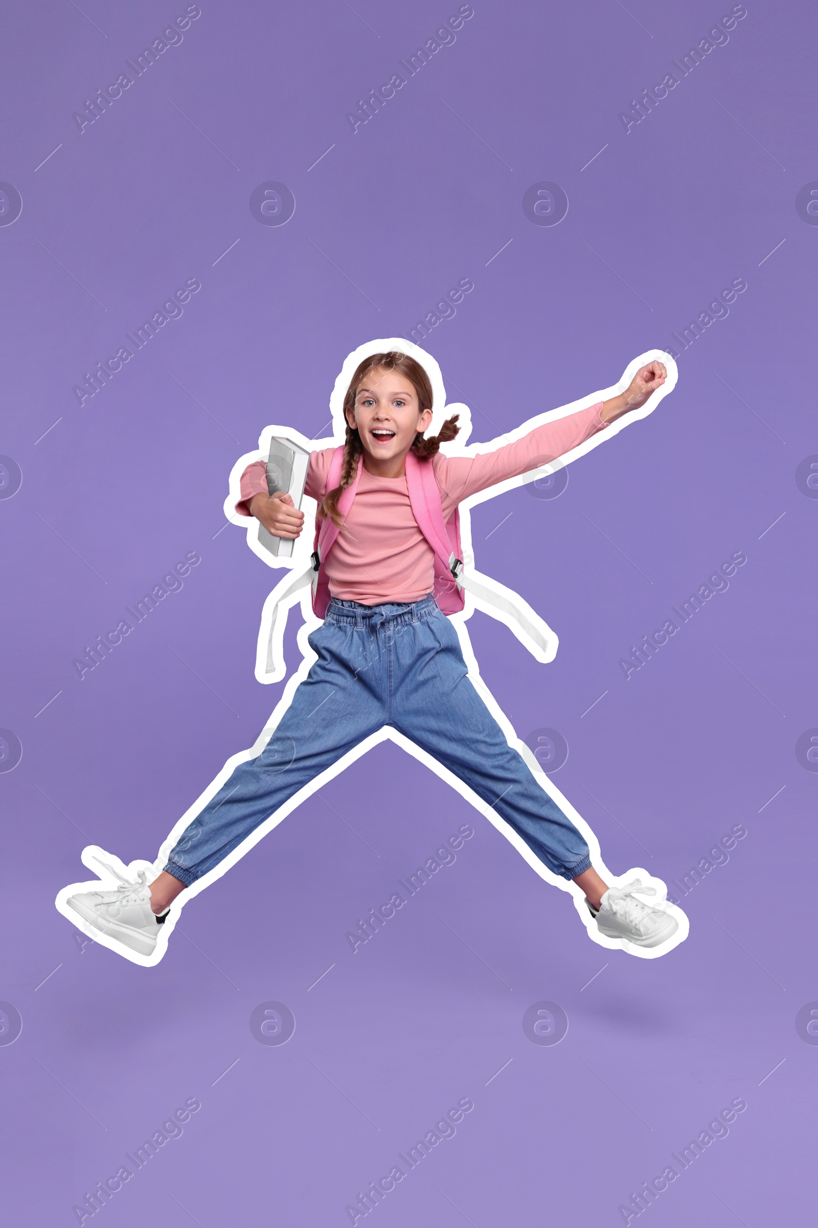 Image of Happy school child with backpack jumping on violet background