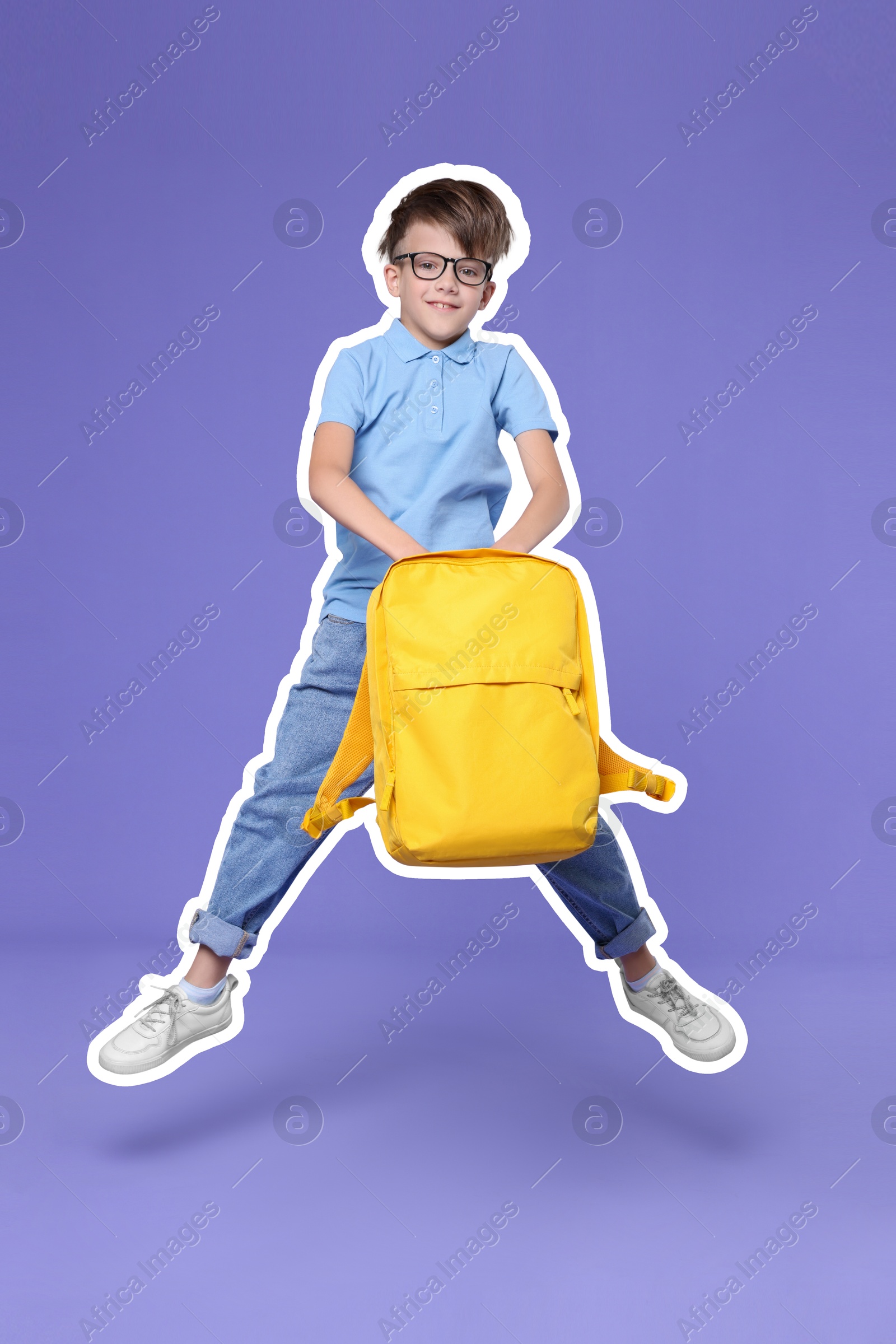 Image of Cute school child with backpack jumping on violet background