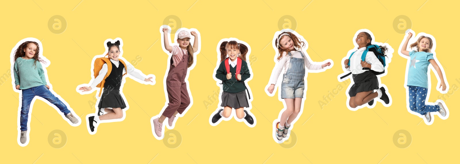 Image of Cheerful children jumping together on yellow background