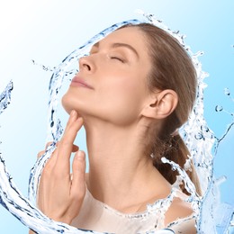 Image of Attractive woman and splashes of water on gradient background