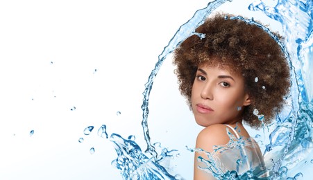 Attractive woman and splashes of water on gradient background