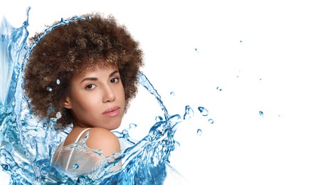 Image of Gorgeous woman and splashes of water on white background