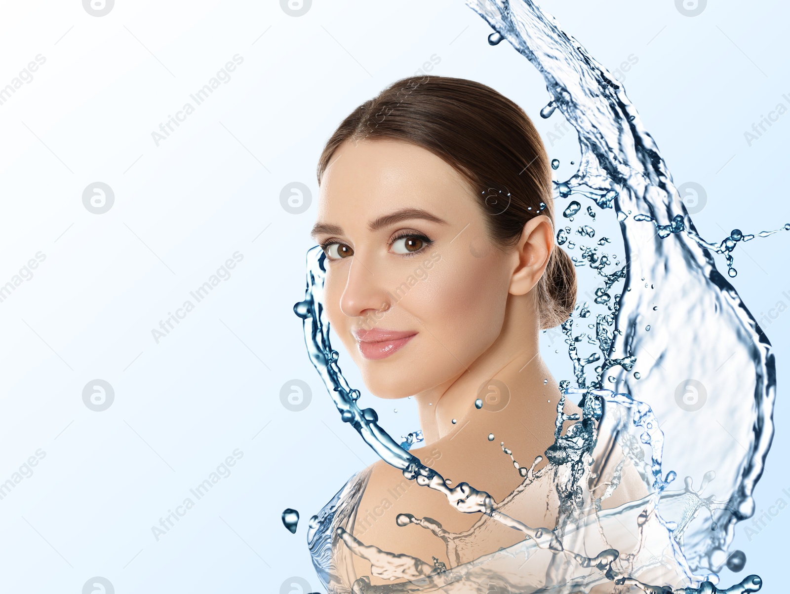 Image of Beautiful woman and splashes of water on gradient background