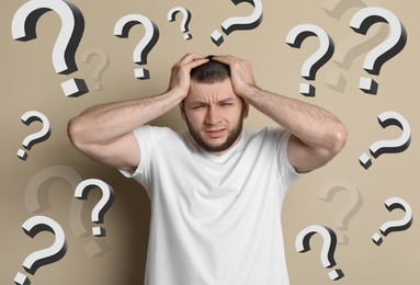 Image of Amnesia. Worried man and question marks on dark beige background