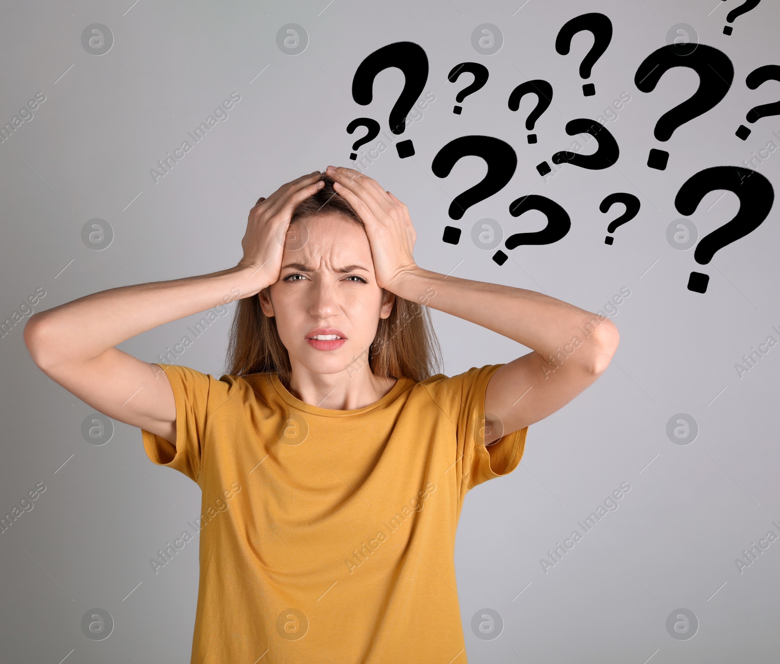 Image of Amnesia. Worried woman and question marks on grey background