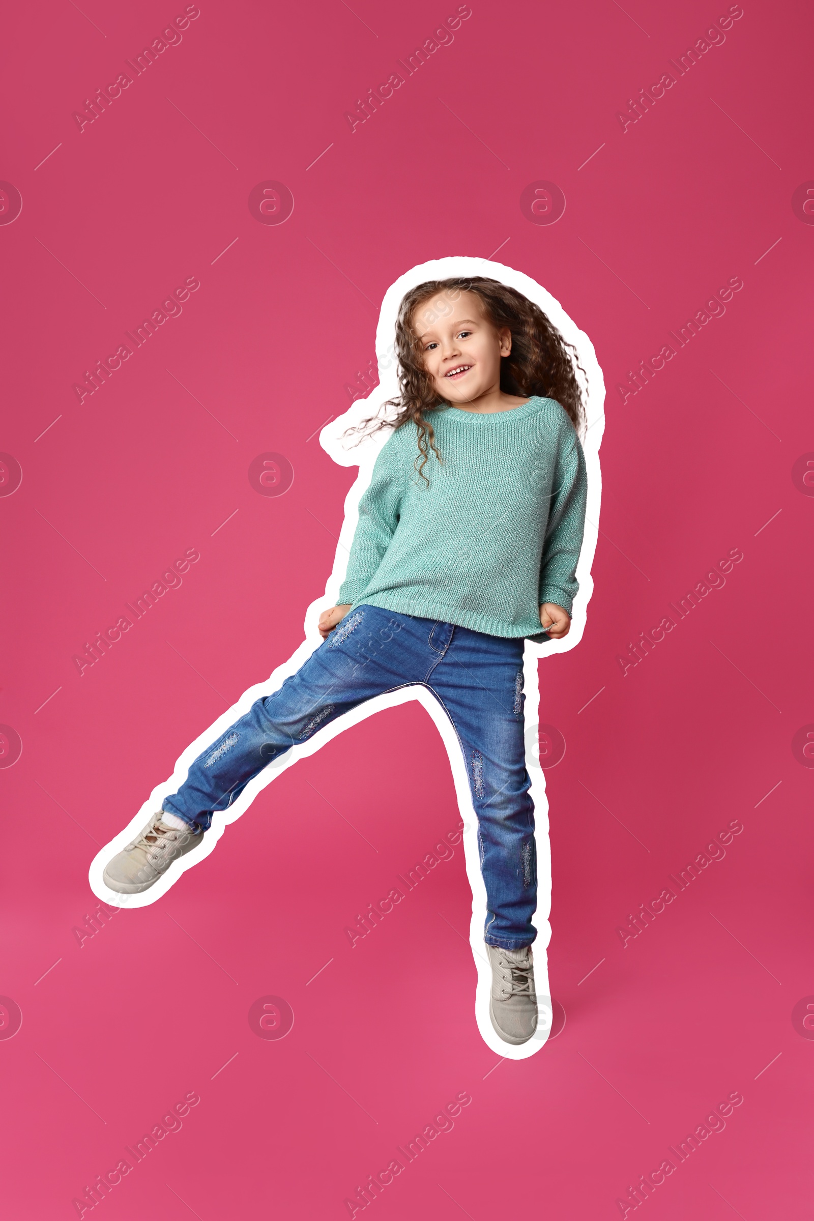 Image of Cute little girl jumping on pink background