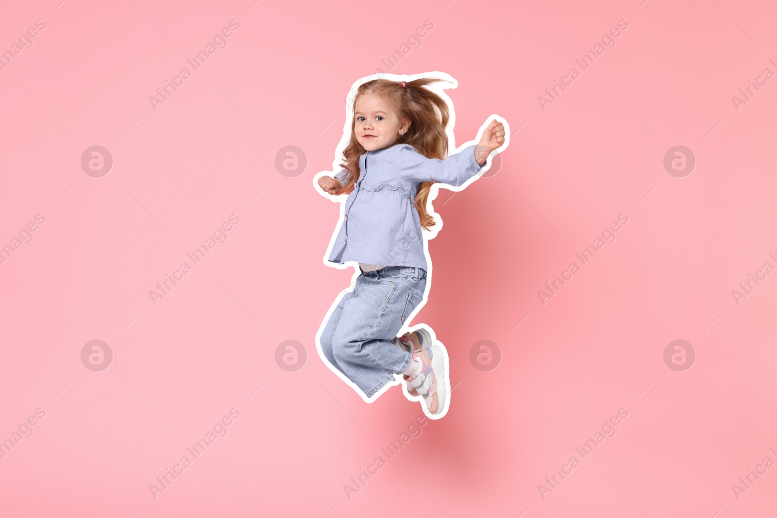 Image of Cute little girl jumping on pink background