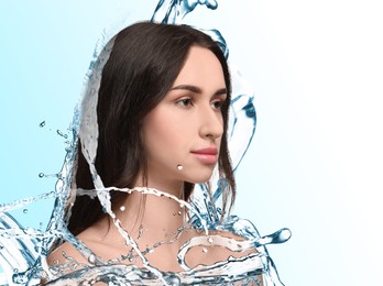 Image of Beautiful woman and splashes of water on gradient background