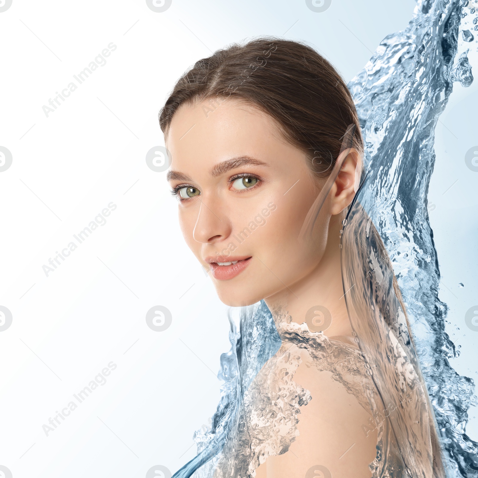 Image of Gorgeous woman and splashes of water on gradient background