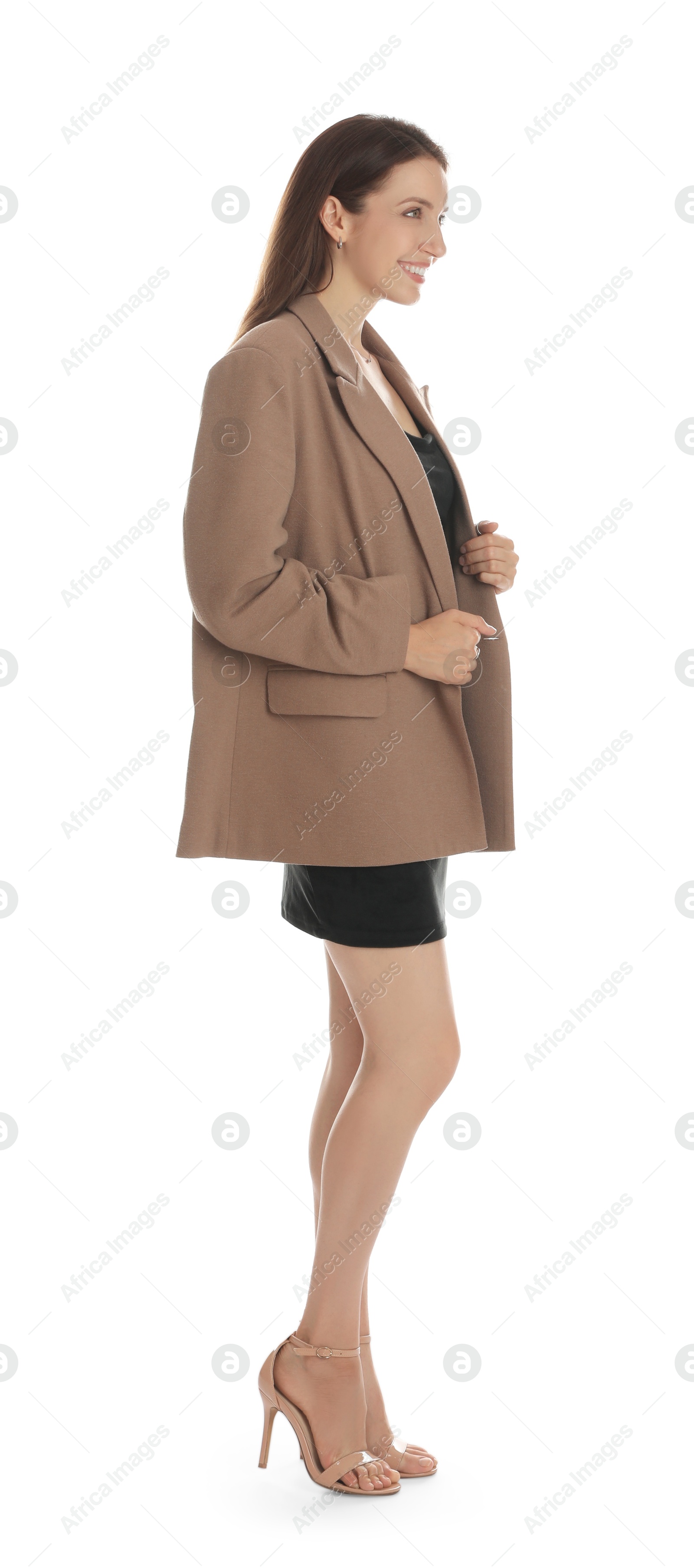 Photo of Beautiful woman in stylish brown jacket and black dress on white background