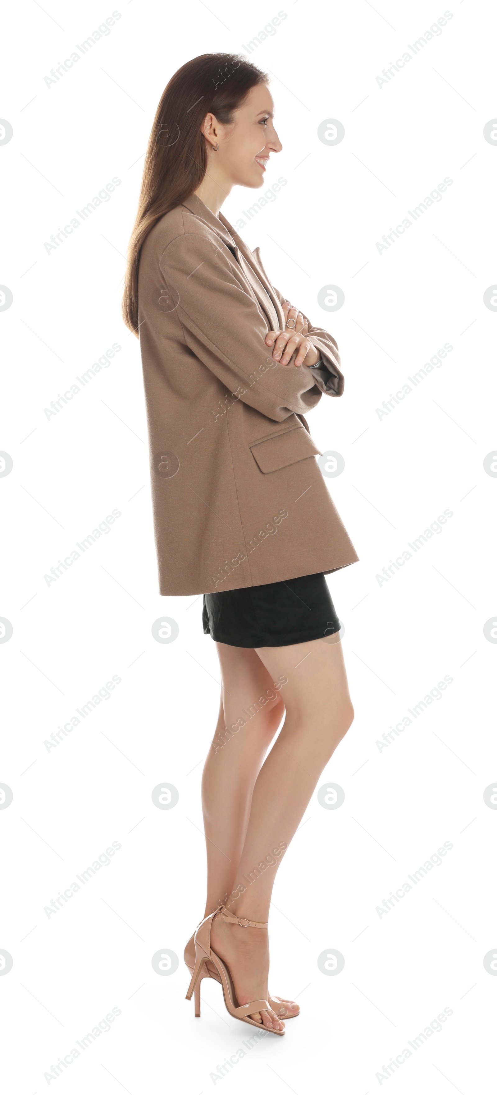 Photo of Beautiful woman in stylish brown jacket and black dress on white background