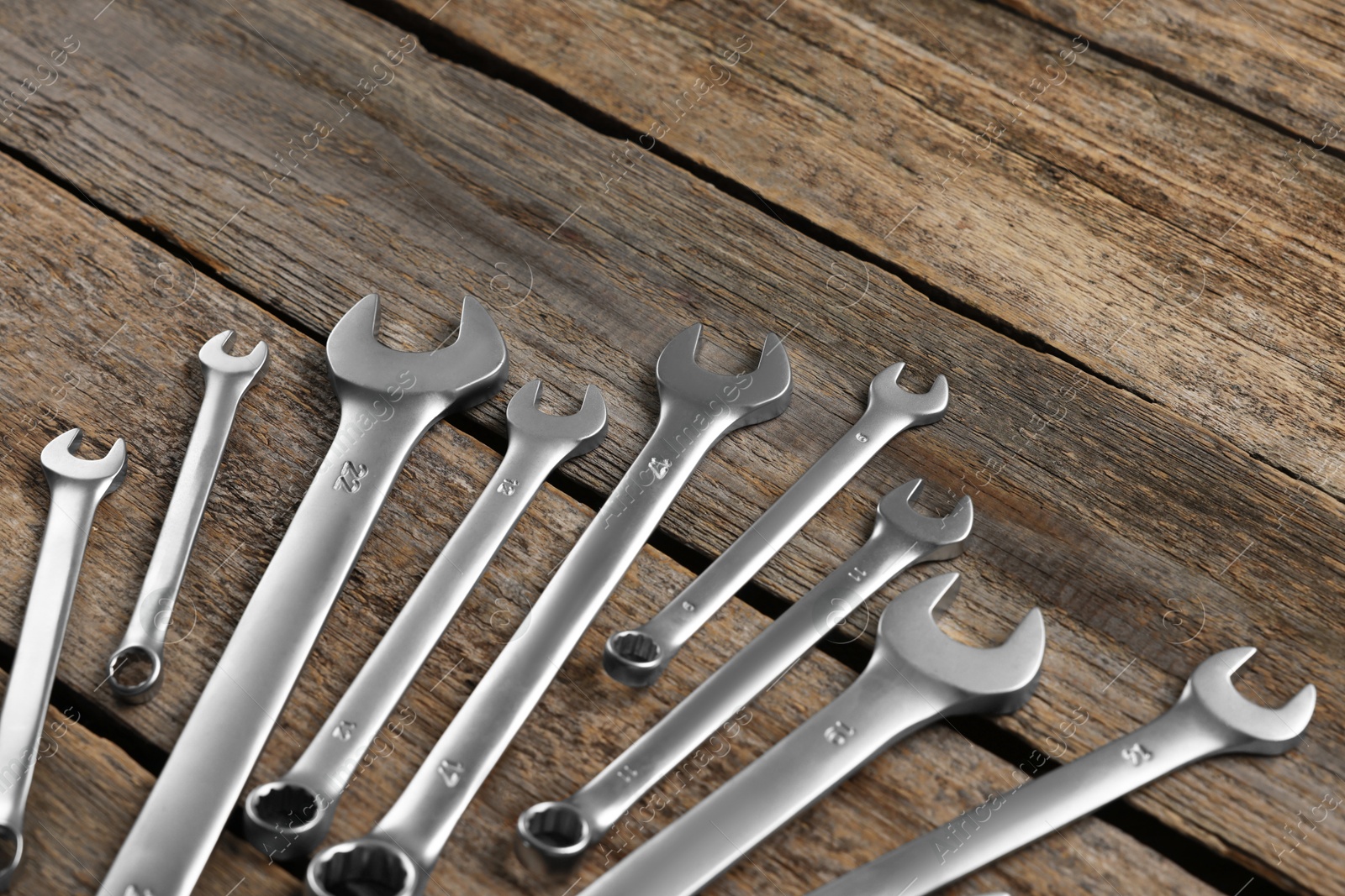 Photo of Many auto mechanic's tools on wooden table