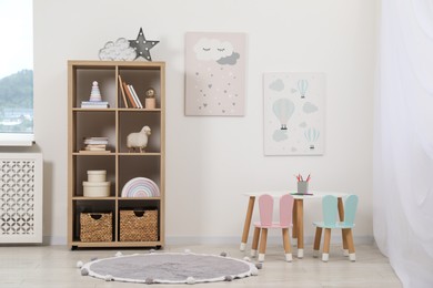 Photo of Child's room interior with modern furniture and beautiful pictures on wall