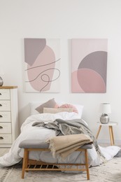 Teen's room interior with modern furniture and beautiful pictures on wall