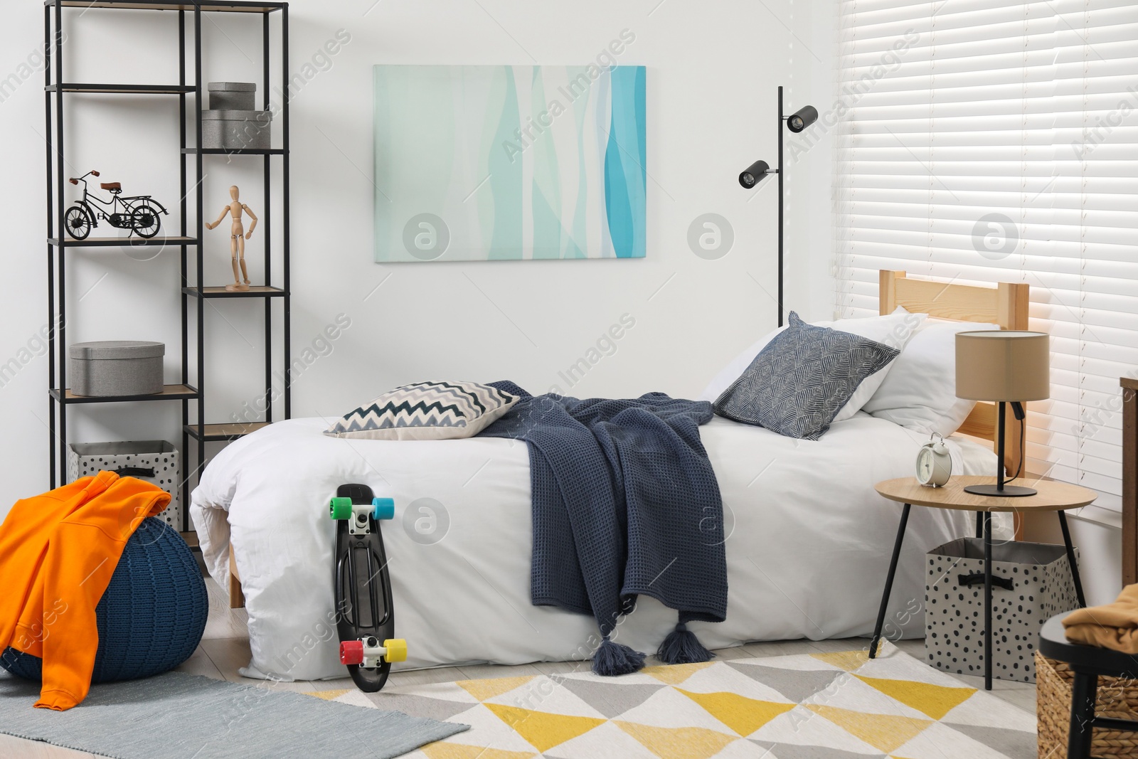 Photo of Teen's room interior with modern furniture and beautiful picture on wall