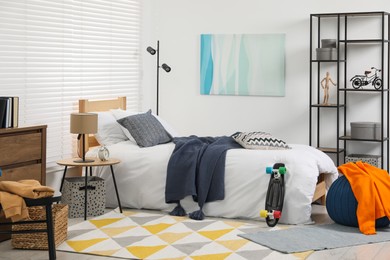 Photo of Teen's room interior with modern furniture and beautiful picture on wall