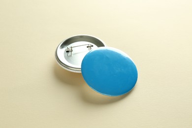 Button badges on beige background. Mockup for design