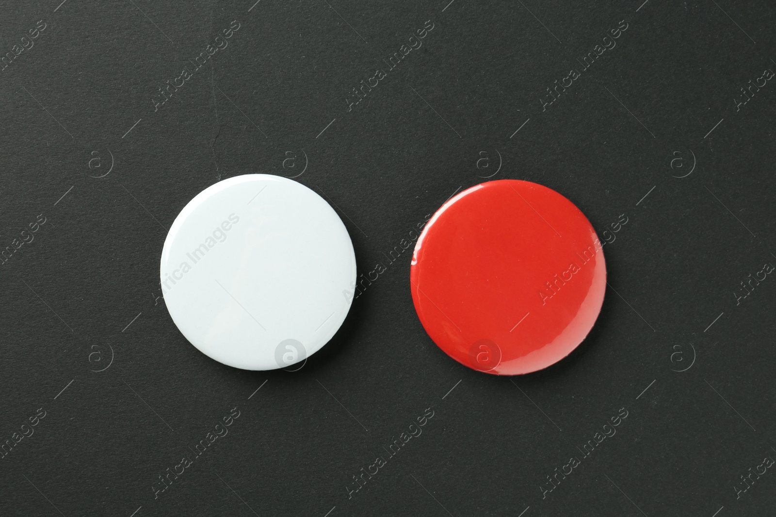 Photo of Button badges on black background, flat lay. Mockup for design