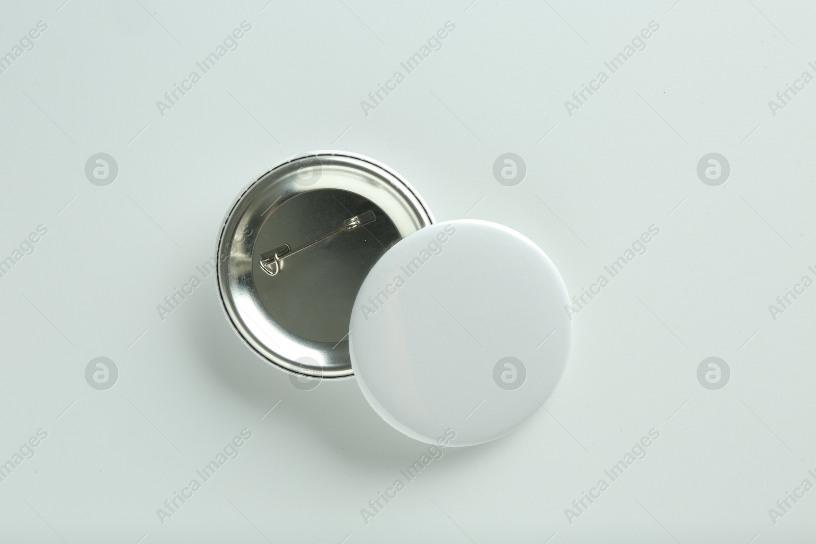 Photo of Button badges on white background, flat lay. Mockup for design