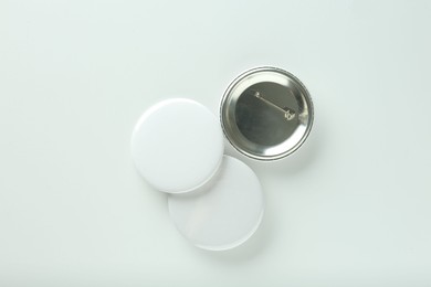 Photo of Button badges on white background, flat lay. Mockup for design