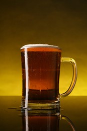 Photo of Glass of beer with froth on dark table, closeup