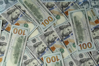 Photo of Many dollar banknotes as background, top view