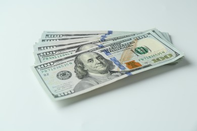 Photo of Many dollar banknotes on white background. American currency